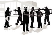 A vector silhouette illustration of working professionals including a janitor, firemen, police officer, and construction crew members.