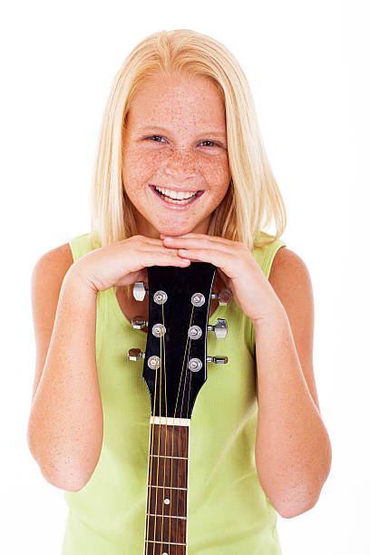 istock young preteen guitarist laughing 476443775