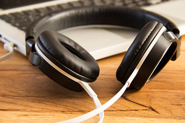 istock Headphones on a laptop 476443986