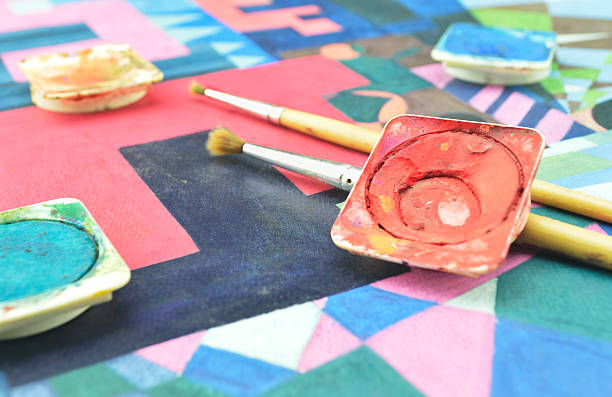 istock Messy used water color paint box and paintbrush 476447460