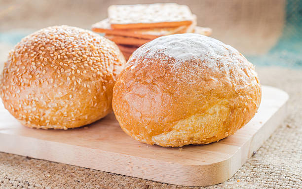 istock fresh bread and wheat on the wooden backgrounds. 476447874