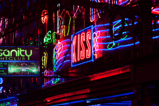 Bangkok, Thailand - February, 28th 2014: Neon bar lights in Soi Cowboy, small redlight district with many gogo bars.