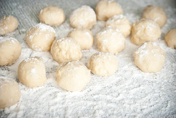 istock Prepared dough in ball shape on silver tray 476451067