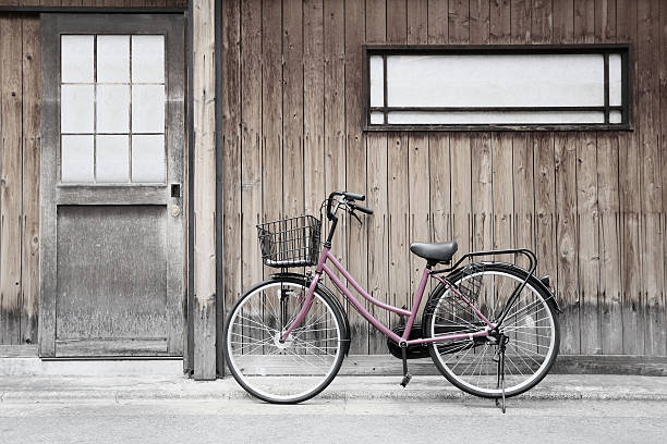 istock Pink bicycle and old wood walls. 476451114