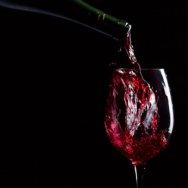 istock bottle and glass with red wine 476451189