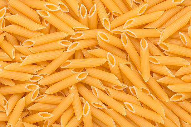 istock Background of penne pasta 476453456