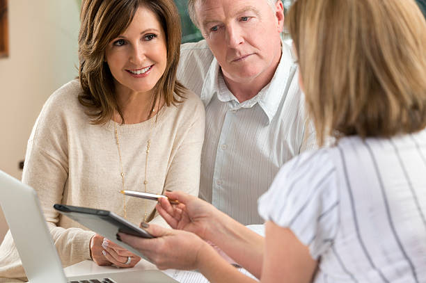 istock Happy mature Couple in Meeting With Advisor 476453469