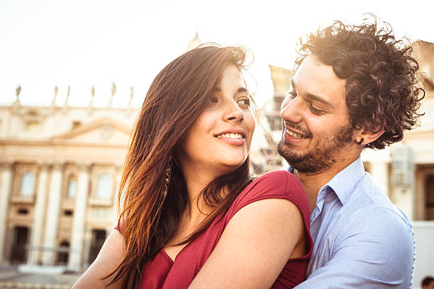 istock Tourist embracing at sunset 476453574