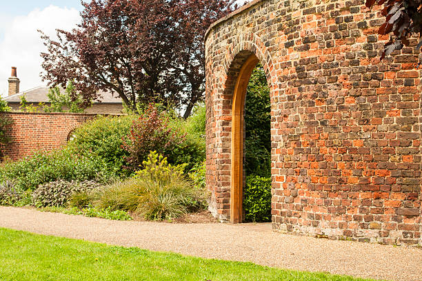 A restored walled garden arch doorway.
