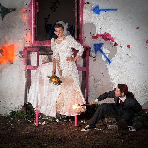 young couple getting married, there is allready fire, like a metaphor for a bad marriage.
