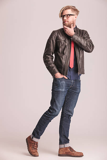 istock Fashion man walking on studio background 476457602
