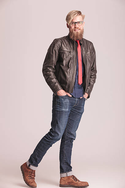istock Tall blond fashion man walking 476457604