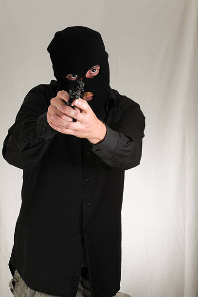 istock Man Holding a Pistol Gun 476461059