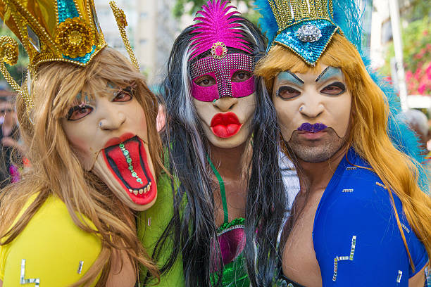 Street Carnival in Rio Rio de Janeiro, Brazil - March 1, 2014: Three drag queens photographed few minutes before Ipanema Band 50th Parade nudie suit stock pictures, royalty-free photos & images