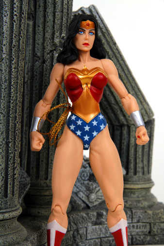 Vancouver, Canada - December 15, 2013: Action figure model of Wonder Woman, released by DC comics, against a black background.