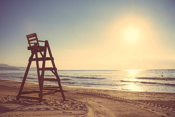 istock Baywatch chair in empty beach at sunset 476464754