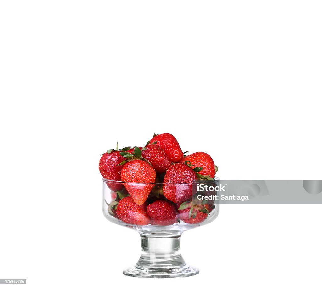 Fresh strawberry fruit in a glass dish isolated Fresh strawberry fruit in a glass dish isolated on a white background. 2015 Stock Photo