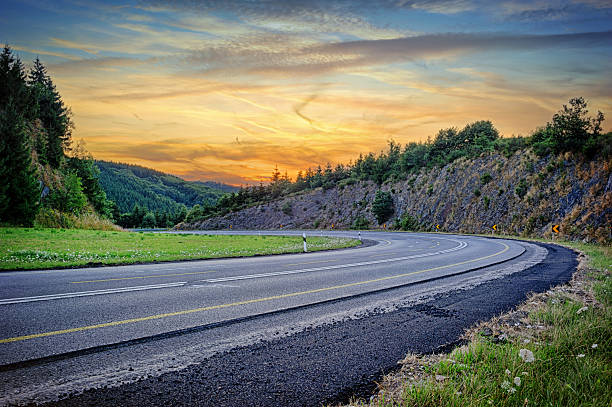 istock Landscape with curvy road at sunset 476465673