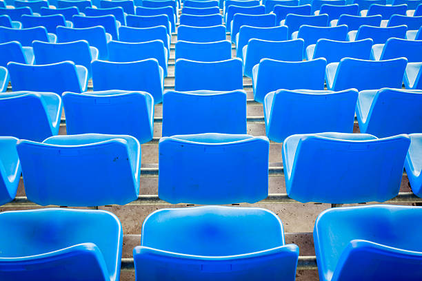 istock Empty dark blue chairs at the football Stadium 476466209