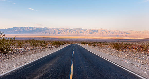 istock Road crossing Death Valley at sunset 476468257