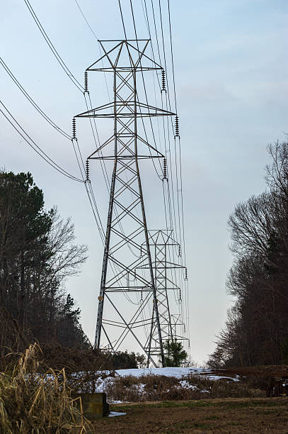 istock High voltage electric power transportation wire and tower 476472429