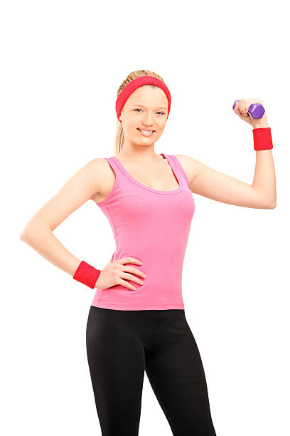istock Young female exercising with a dumbbell 476472481