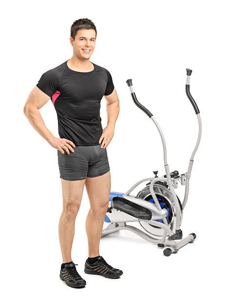 istock Male athlete standing near a cross trainer machine 476472499