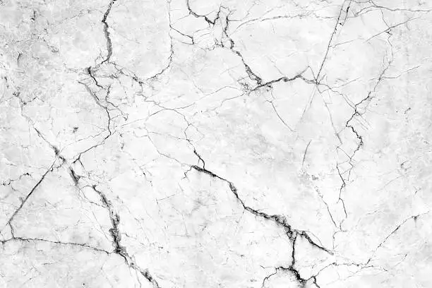 Cracks in the marble pattern tile wall.