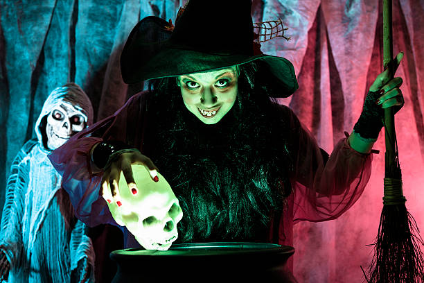 istock Halloween:  Witch cooking her brew for special guests. 476479637
