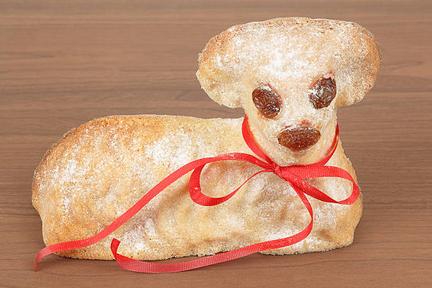 istock Easter lamb with powdered sugar wooden background 476480461