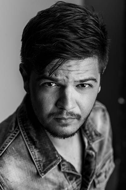istock Black and white portrait of a handsome macho or badboy 476483390