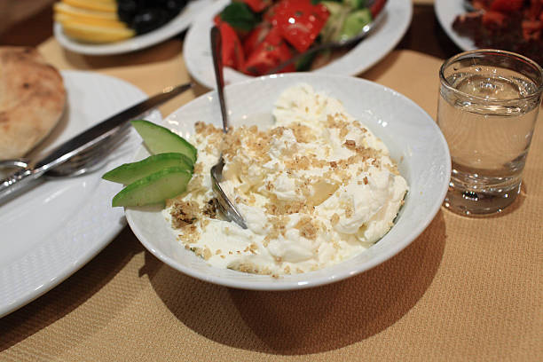 istock Plate of squeezed yogurt with walnuts 476483502
