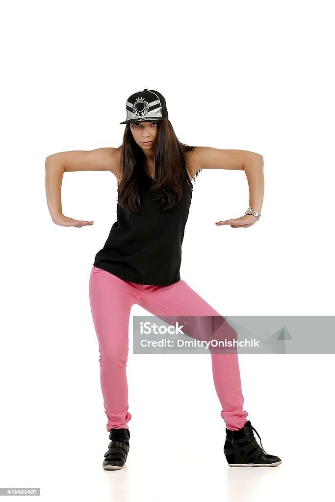 Young female brunette hip-hop dancer Young female brunette hip-hop dancer performing a dancing moves 20-29 Years Stock Photo