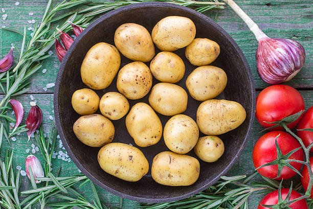 istock Potatoes for roasting with rosemary  and  garlic 476487750