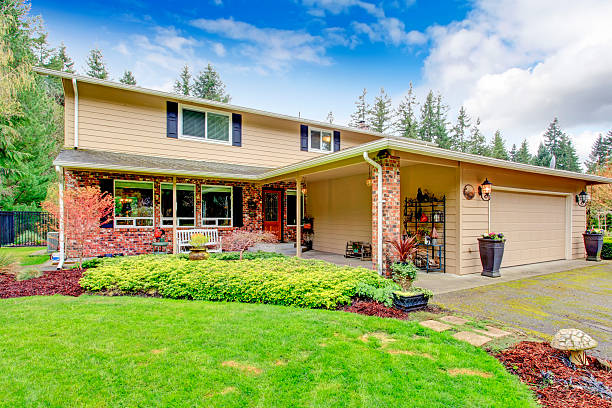 istock Two story house with attached garage and open column porch 476488713
