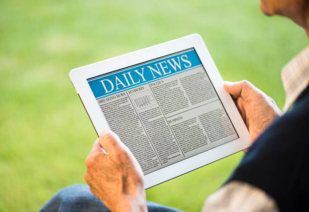 istock Senior man reading news on tablet pc 476489663