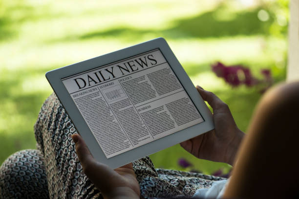 istock Woman reading news on Tablet pc 476489917