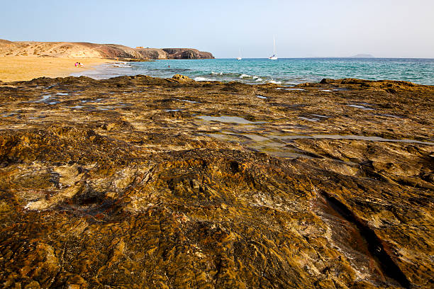 istock light beach  boat  rock  water  and summer 476490169
