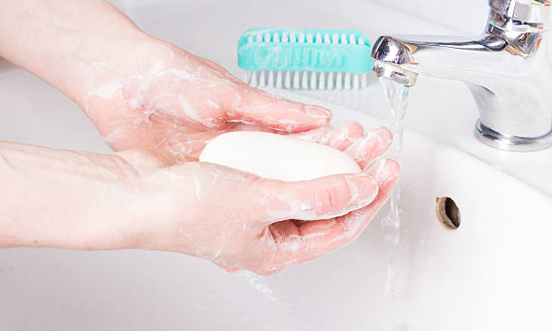 istock woman washing her hands 476490478