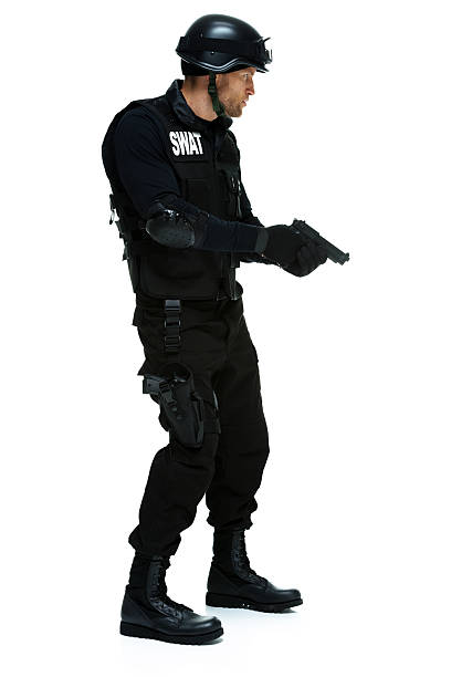 istock Police in action with handgun 476491216