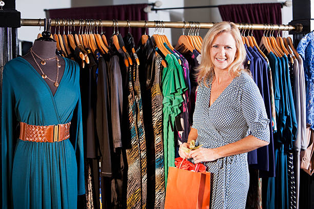 Mature woman (40s) in a clothing store.