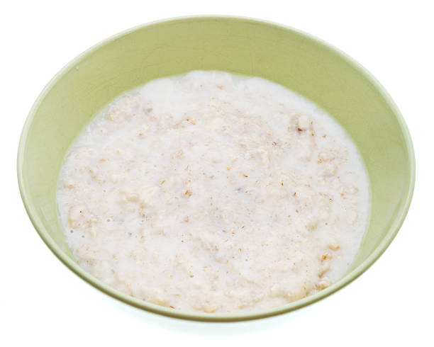 istock oat porridge with milk in ceramic bowl 476492033
