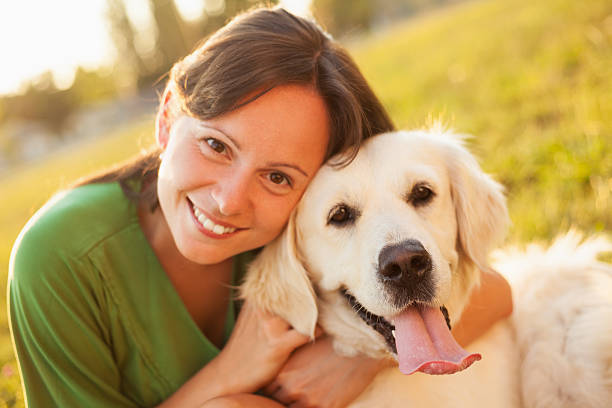 istock Young woman with dog 476492189