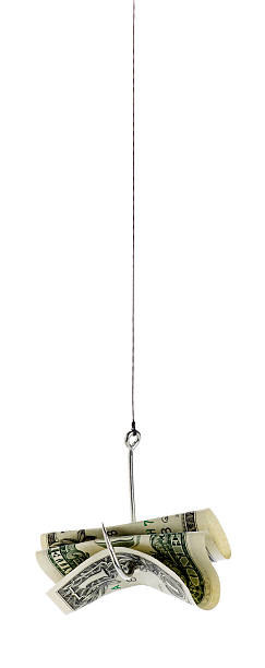 istock Dollar Bill hanging on a Fishing Line 476493556