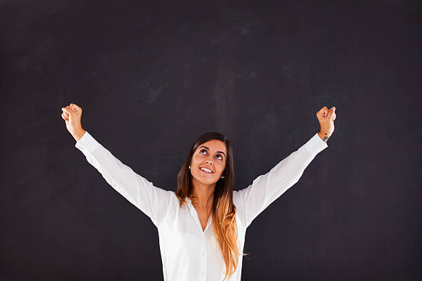 istock Happy woman looking up 476494020
