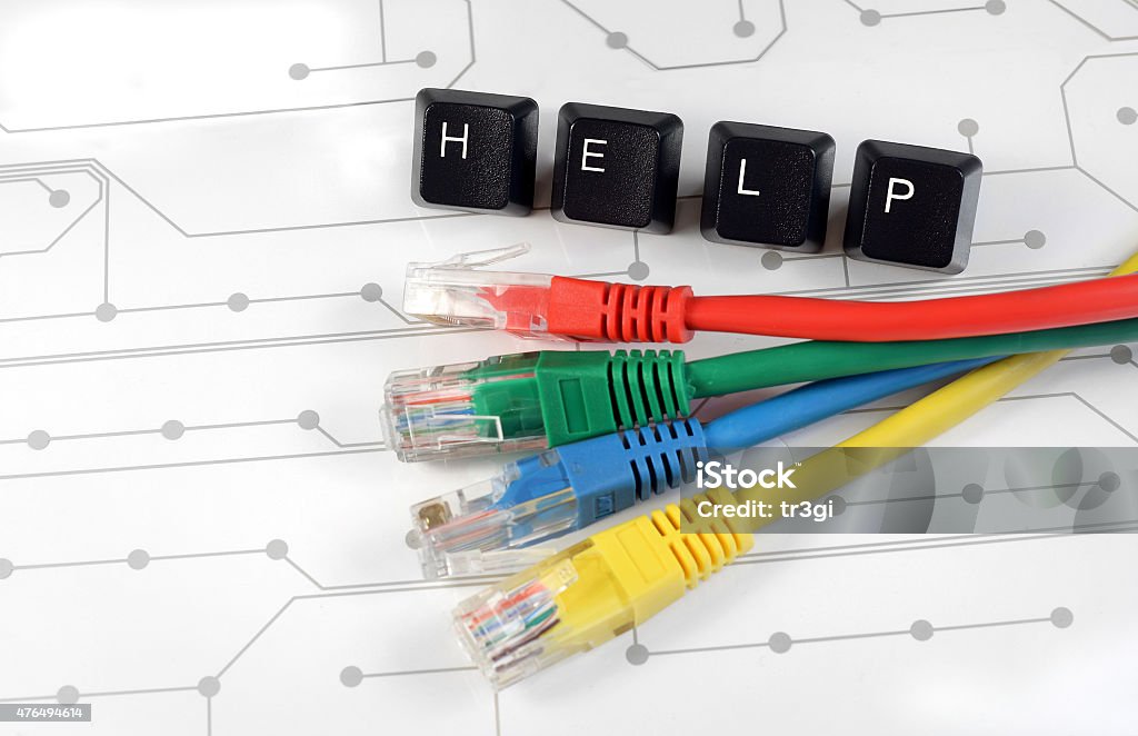 IT help, assistance, network cables circuit board background IT HELP, Assistance - HELP made of keyboard keys with colourful network cables on white circuit board background 2015 Stock Photo