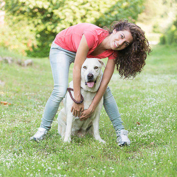 istock Young Woman with Dog 476494863
