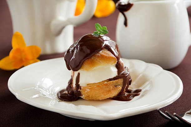 istock profiteroles with ice cream and chocolate. 476495837