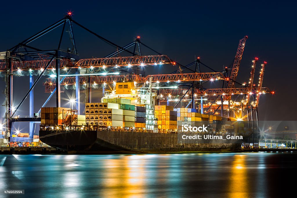 Ship loaded in New York container terminal Cargo ship loaded in New York container terminal at night viewed from Elizabeth NJ across Elizabethport reach. Commercial Dock Stock Photo