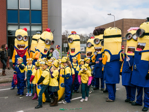 Boskoop, the Netherlands - March 1, 2014: Group of despicable me, minions in the Carnival Parade  truck in Boskoop